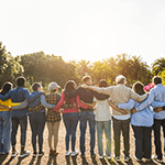 People-Together-Building-Trust-Rural-Summit-Homepage-Callout Line of people embracing