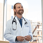 Strong-Culture-Doctor-Rural-Summit-Homepage-Callout Male doctor smiling