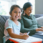 Women-Daughter-Financial-Resistance-Rural-Summit-Homepage-Callout Young girl smiling with women beside her